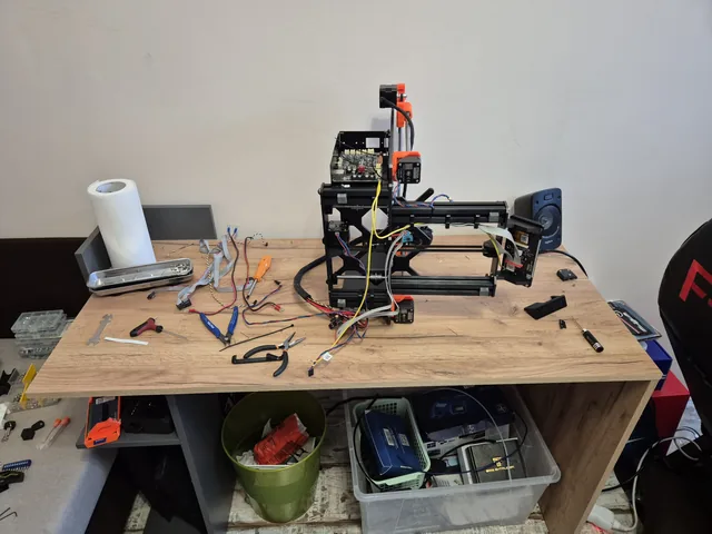 Prusa part-assembled on the workbench with the wiring loom laid out